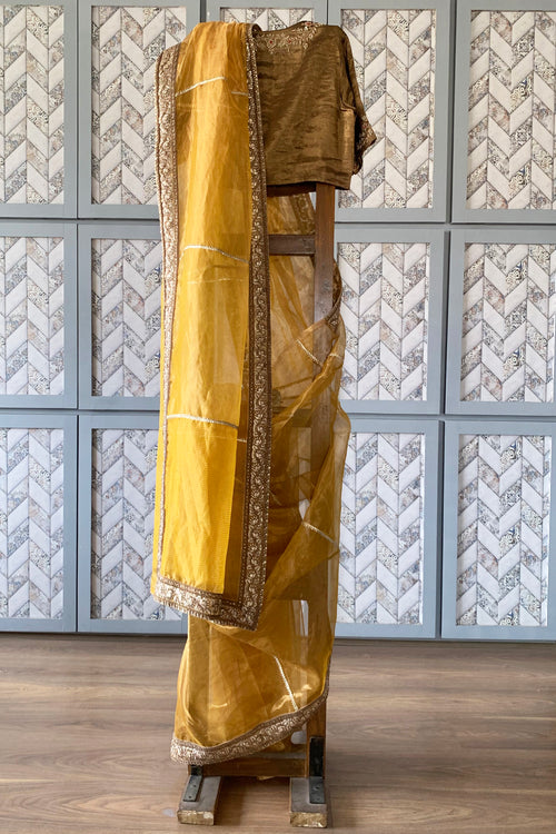 Gold tissue sari with rich border and gota lines