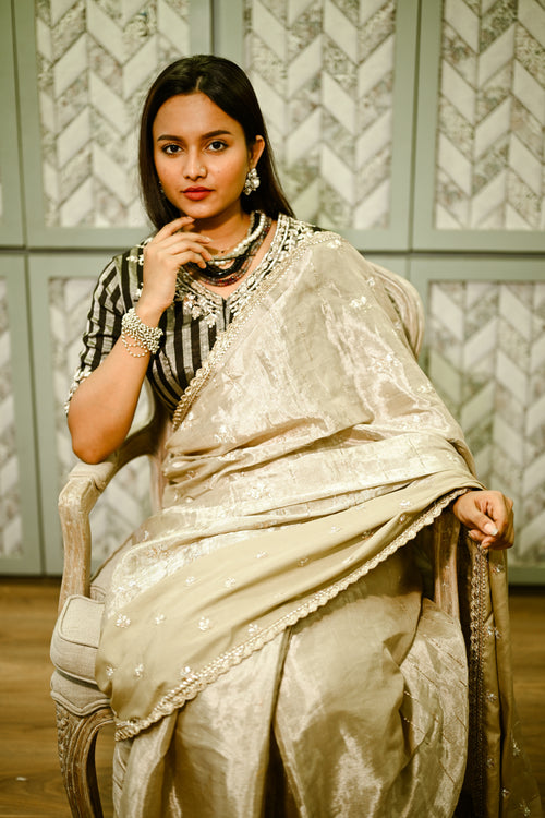 Beige Tissue embroidered sari with black silver blouse
