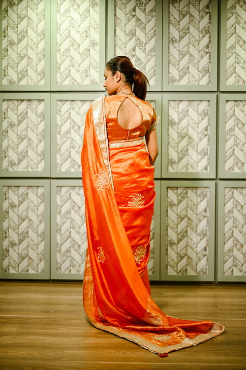 Orange silk handwoven sari with hand sequence work