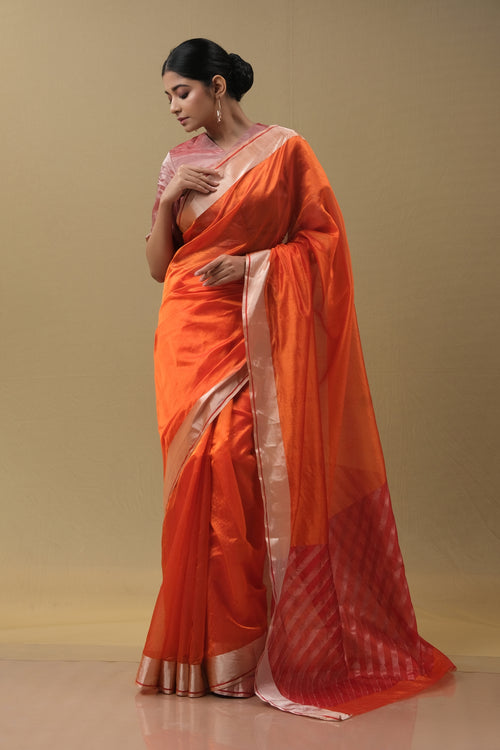 Orange silk sari with red pallu