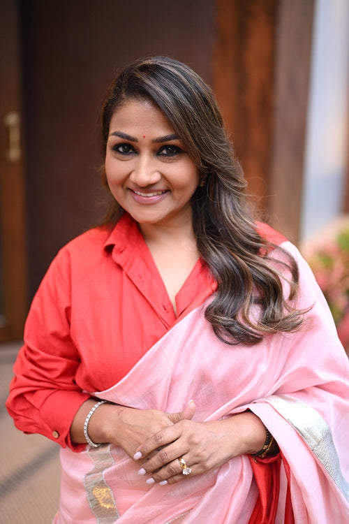 Dolly Jain peach sari with red mushru border with gota lines